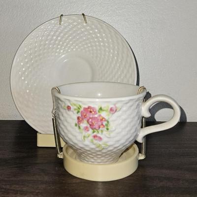 Vintage 1985 Floral Teacup and Cream-Colored Saucer