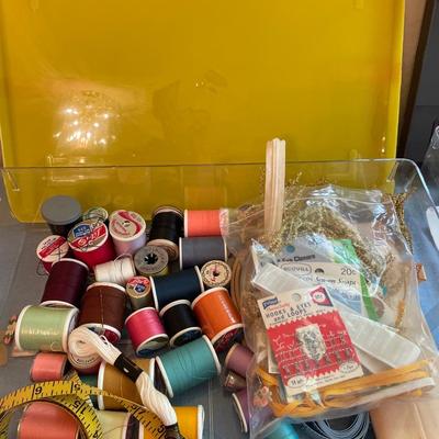Vintage plastic containers with crafting items