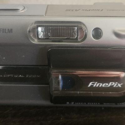 Fuji Film Digital Camera with wires and carrier