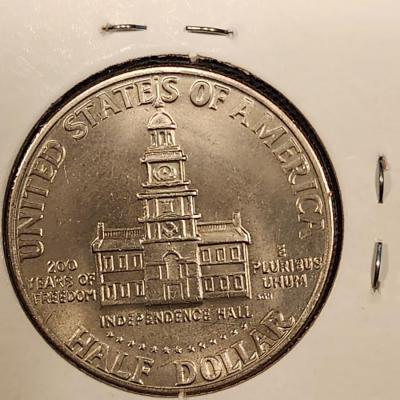 Uncirculated 1976 Eisenhower Ike Dollar, 1976 Kennedy Half Dollar , 1976 Quarter