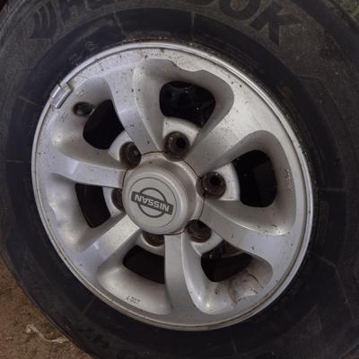 Nissan Rims with Hankook Optimo P225/70 14" Tires Set of Four