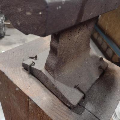 Steel Railroad Rail Anvil on Wood Block
