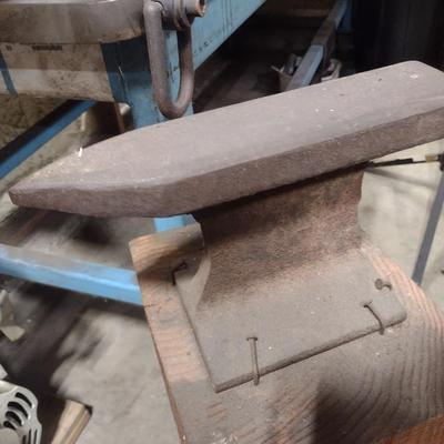 Steel Railroad Rail Anvil on Wood Block