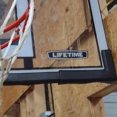 Lifetime Adjustable Basketball Goal with Weighted Base and Shatter-Proof Glass Like New Condition