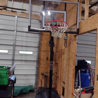 Lifetime Adjustable Basketball Goal with Weighted Base and Shatter-Proof Glass Like New Condition