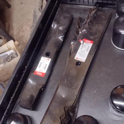 Collection of New Mower Blades and Small Engine Oil Filters Choice D