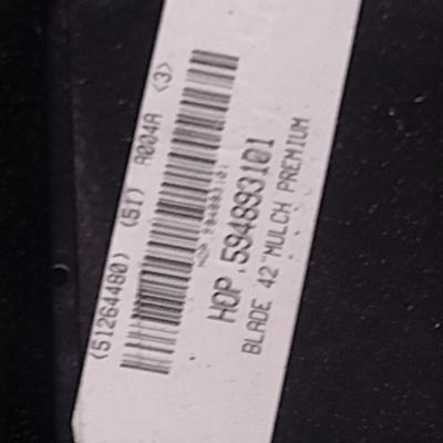 Collection of New Mower Blades and Small Engine Oil Filters Choice D