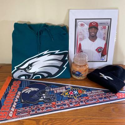LOT 12X: Sports Collectables - Eagles Clothing, Broncos Candle & More