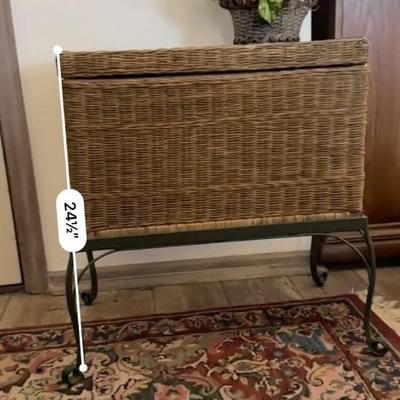 Wicker chest on stand with a rug