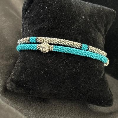 Turquoise tone and silver tone small beaded stretchy bracelets