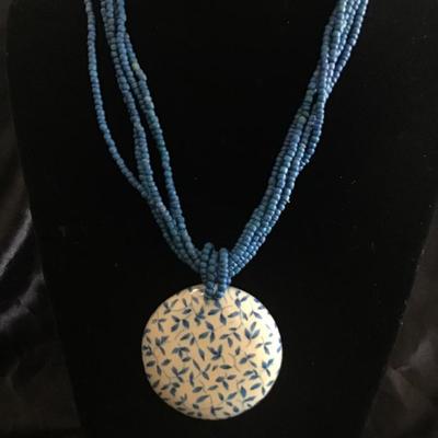 What is beaded multi strand necklace with large pendant