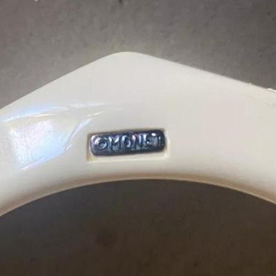 Vintage Monet Cream/Off White Lucite Faceted Chunky Bangle Bracelet Signed 1-1/8" Wide in Good Preowned Condition.