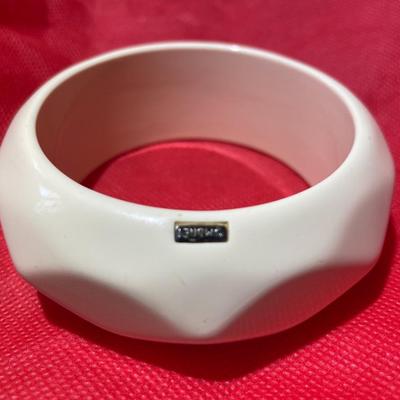 Vintage Monet Cream/Off White Lucite Faceted Chunky Bangle Bracelet Signed 1-1/8" Wide in Good Preowned Condition.