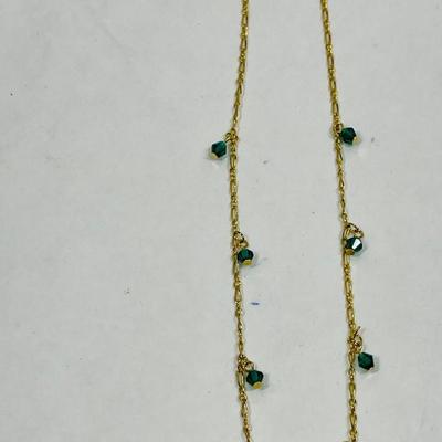 goldtone necklace with emerald green stones