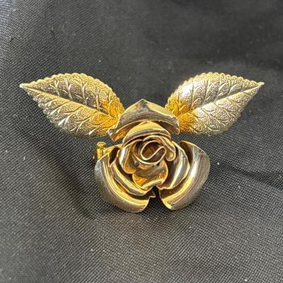 Gold toned rose and leaf brooch