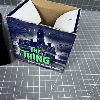 The Thing From the Adams Family Piggy Bank