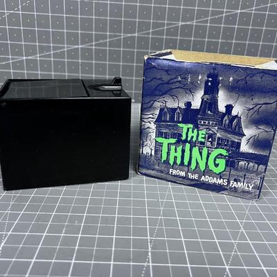 The Thing From the Adams Family Piggy Bank