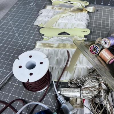 Sewing Items; Thread, Lace, Appliques  with a sm. Basket