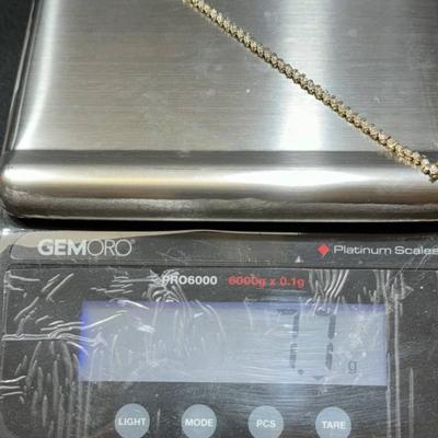 14 k Gold and diamond tennis bracelet
