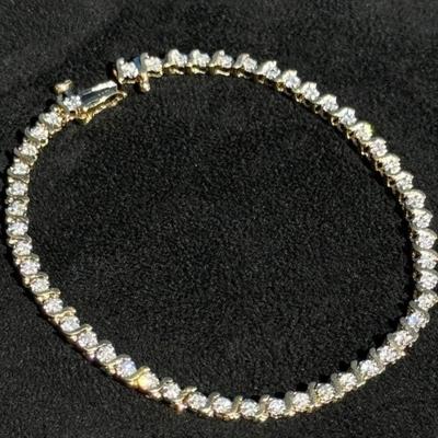 14 k Gold and diamond tennis bracelet