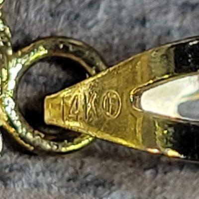 14 k Gold necklace 999 charm