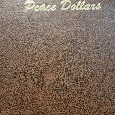 Complete peace dollar book including Rare 1921 thru 1935 reserve set