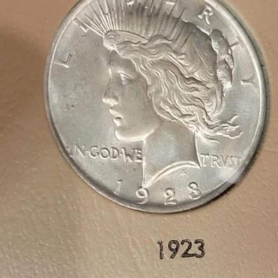 Complete peace dollar book including Rare 1921 thru 1935 reserve set