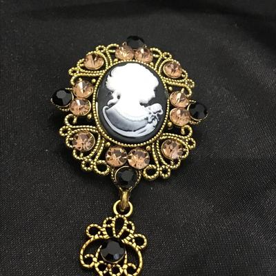 Inspired Black/White Acrylic Crystal Cameo Brooch in Aged Gold Tone