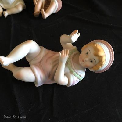 Lot 17- Seven Ceramic Baby Figurines 