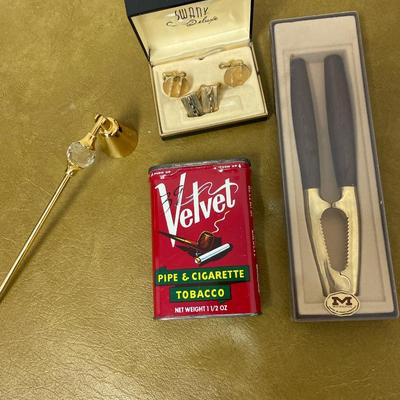 Velvet tin, cuff links and Monopol nut cracker