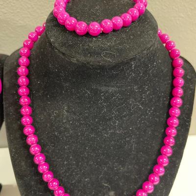 Magenta bead necklaces and bracelet