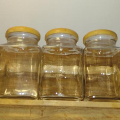 Trio of Glass Canisters with Wooden Lids and Holder
