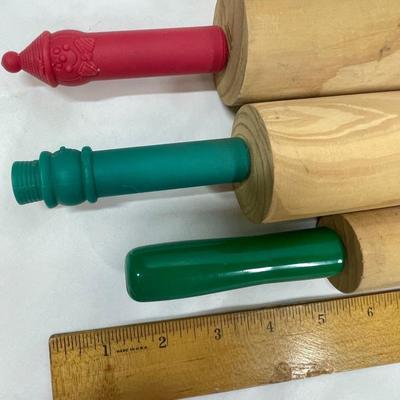 3 small wooden rolling pins with plastic handles
