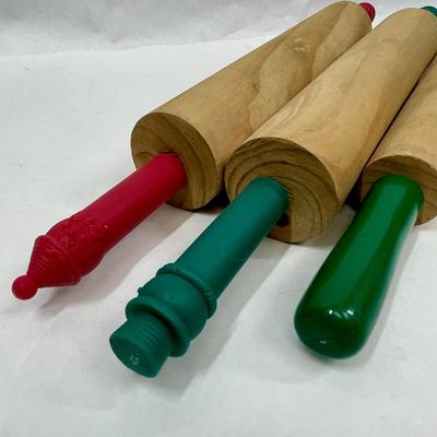 3 small wooden rolling pins with plastic handles