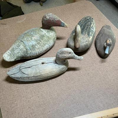 4 Well used wood decoys