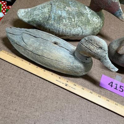 4 Well used wood decoys