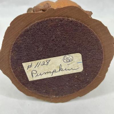 Figurine: Young Girl Seated next to Pumpkin