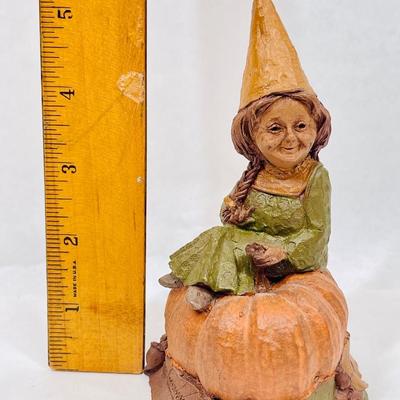 Figurine: Young Girl Seated next to Pumpkin