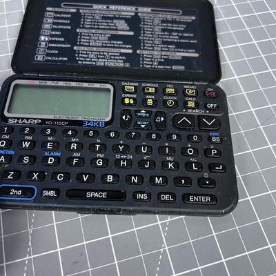 Texas Instrument TI 83 Graphic Calculator and Sharp Calculator