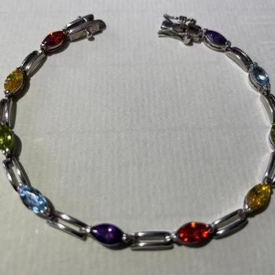 Vintage Sterling Silver Multi-Color Stone Tennis Bracelet 7.25" Long in Good Preowned Condition as Pictured.