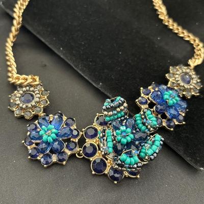 MNG gold tone statement blue flower necklace