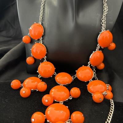 Silver tone orange statement necklace