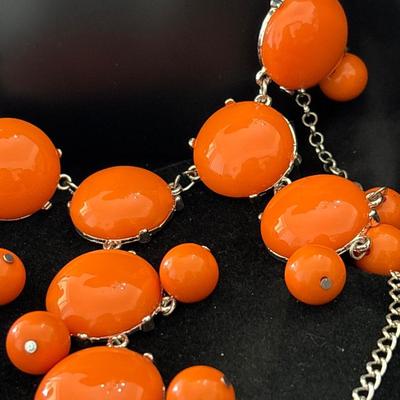Silver tone orange statement necklace