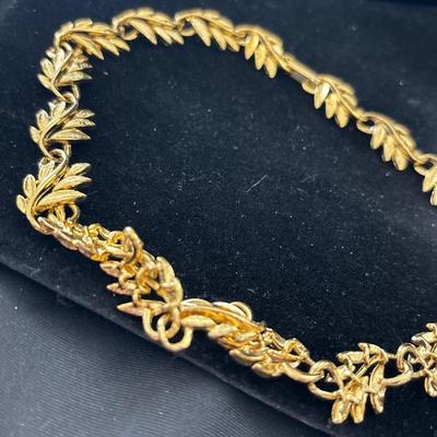Gold tone leaf bib necklace