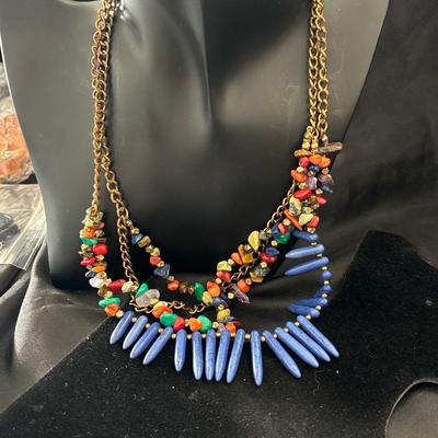 Gold tone necklace with colorful beaded and stone charms