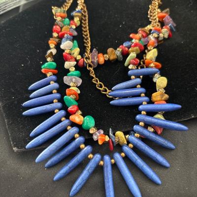 Gold tone necklace with colorful beaded and stone charms