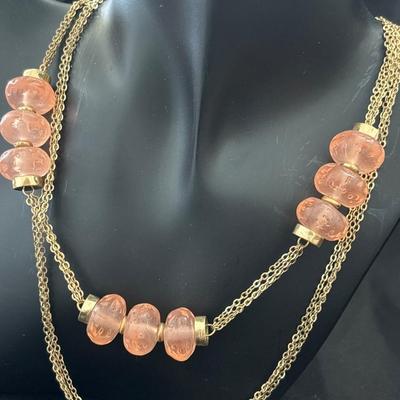 Gold tone pink beaded necklace