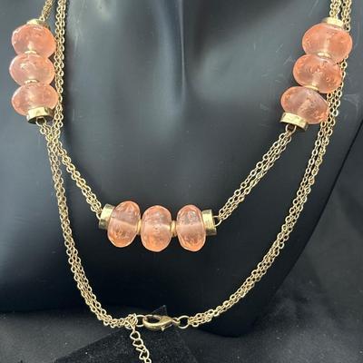 Gold tone pink beaded necklace