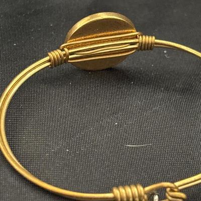 Gold tone L and D embrace the journey bracelet