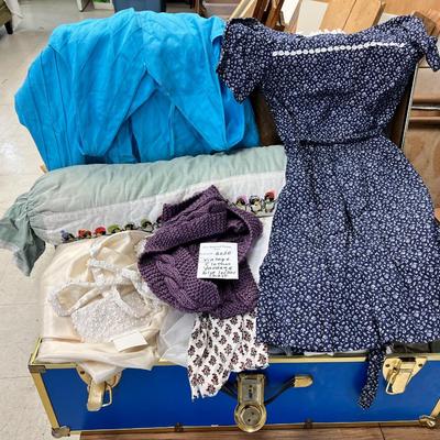 Blue storage locker full of vintage clothes, yardage